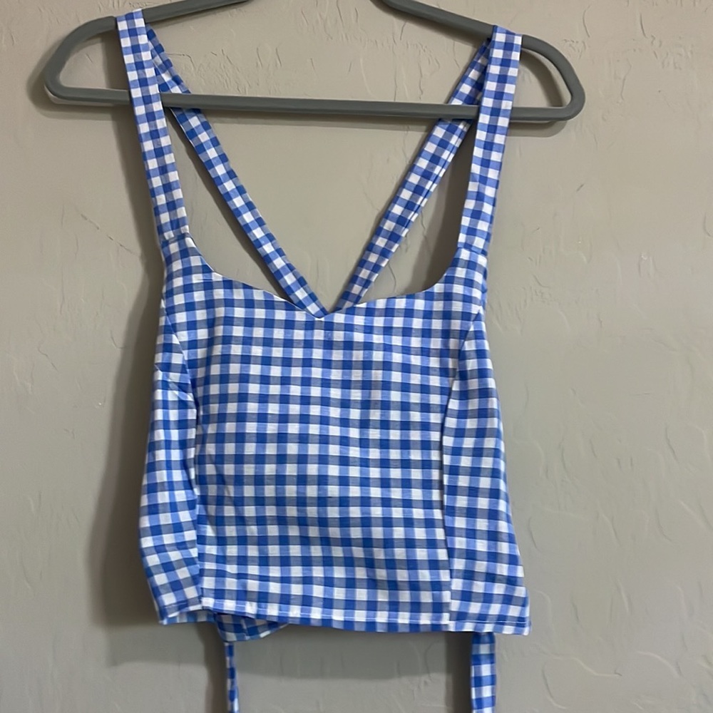 Cute top, blue, brand is shein, lots of back will show.